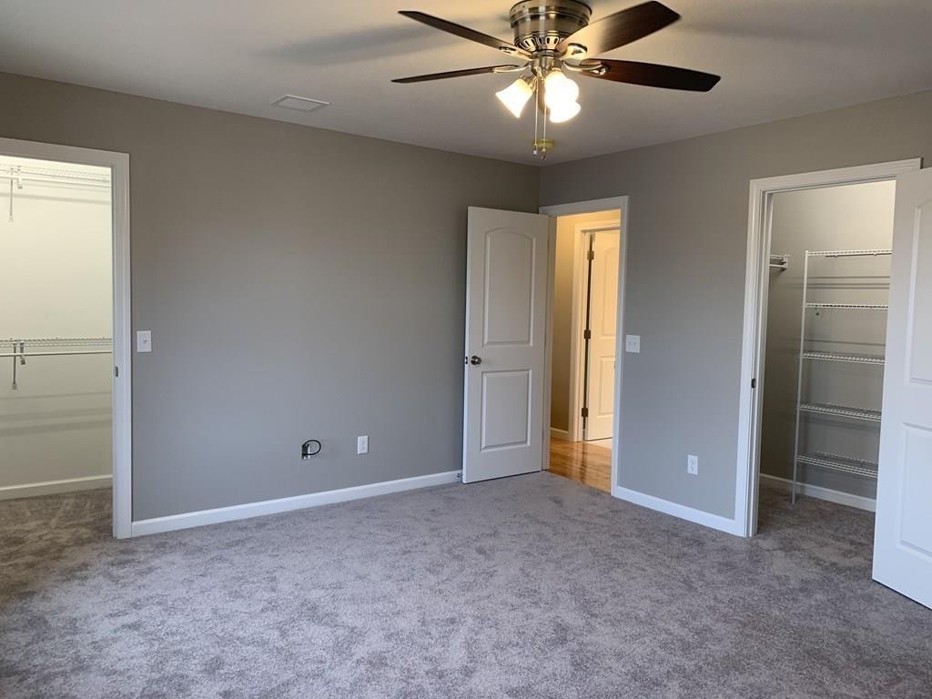 55 Delaware Avenue Springfield, MA 01119 - Photo 9 of 20 an empty room with closet and a chandelier fan