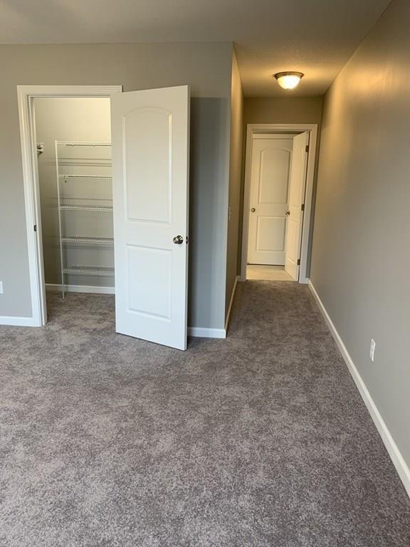55 Delaware Avenue Springfield, MA 01119 - Photo 10 of 20 an empty room with closet and mirror