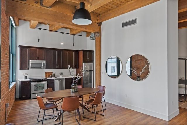 a kitchen with a sink and a refrigerator