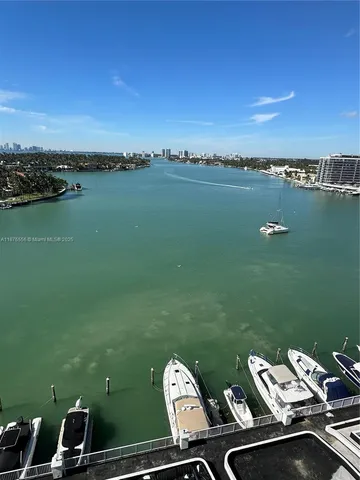 a view of a lake with a car parked