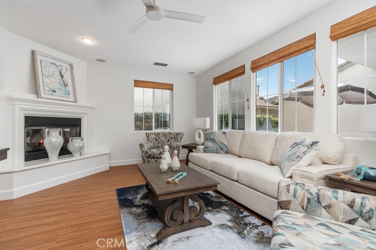 309 Flint Avenue Long Beach, CA 90814 - Photo 15 of 37 a living room with furniture a fireplace and a floor to ceiling window