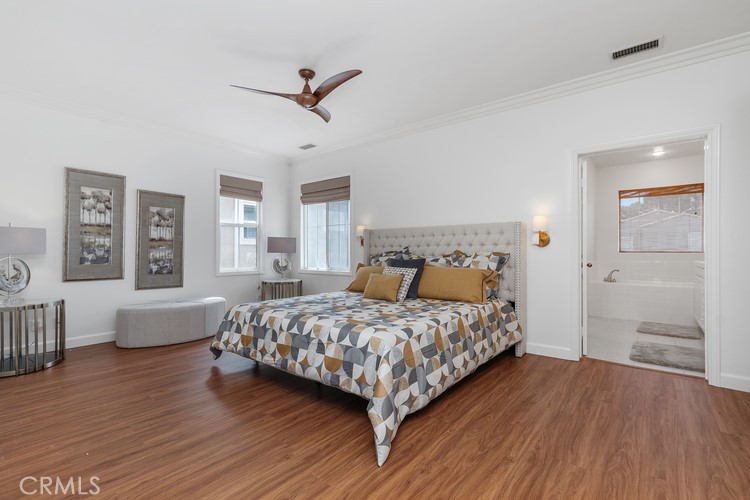 309 Flint Avenue Long Beach, CA 90814 - Photo 19 of 37 a bedroom with a bed and wooden floor