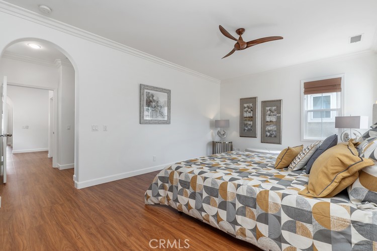 309 Flint Avenue Long Beach, CA 90814 - Photo 20 of 37 a bedroom with a bed and wooden floor