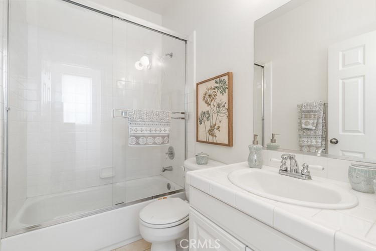309 Flint Avenue Long Beach, CA 90814 - Photo 25 of 37 a bathroom with a sink toilet and shower