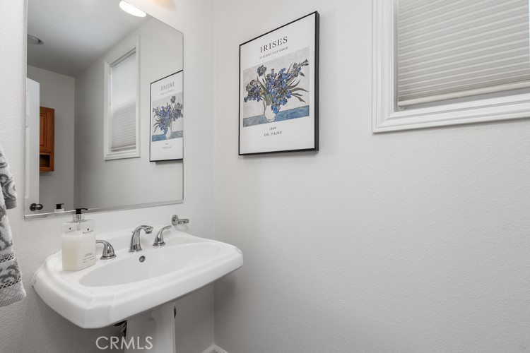 309 Flint Avenue Long Beach, CA 90814 - Photo 27 of 37 a bathroom with a sink and a mirror