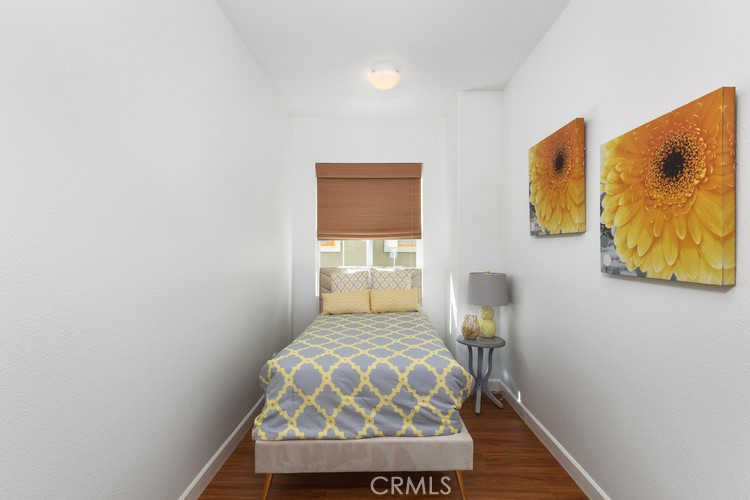 309 Flint Avenue Long Beach, CA 90814 - Photo 30 of 37 a bedroom with a bed and painting on the wall