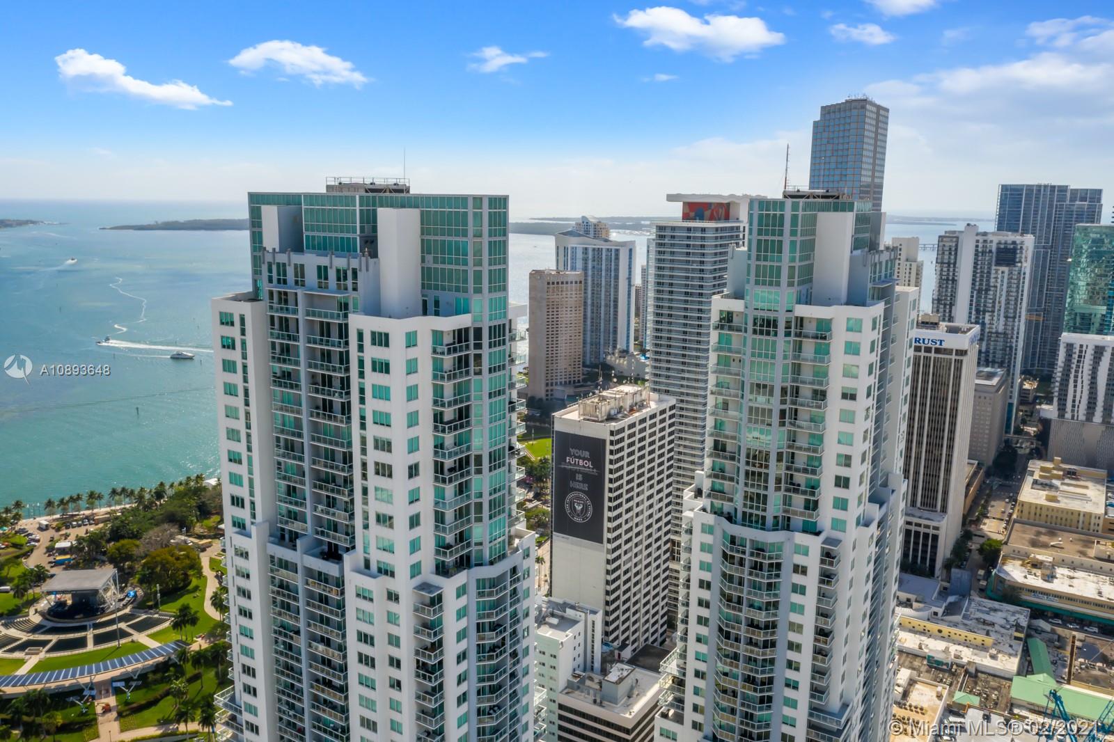 244 Biscayne Boulevard, Unit 3406 Miami, FL 33132 - Photo 17 of 20 a city view with tall buildings
