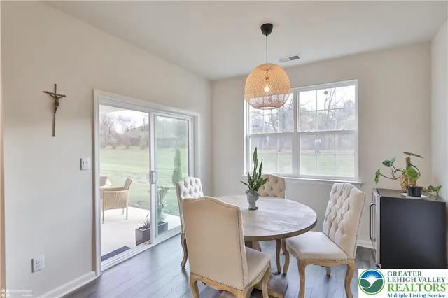 a bed room with a bed furniture and a flat screen tv