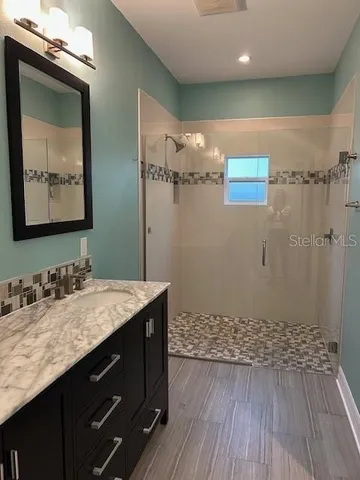 a bathroom with a sink and a mirror