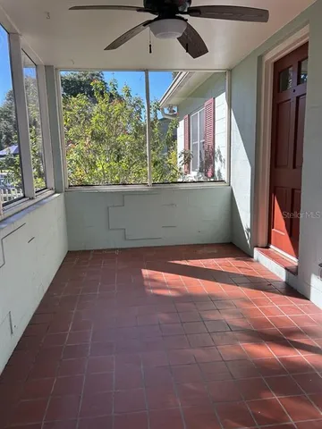 a view of room with window and entryway