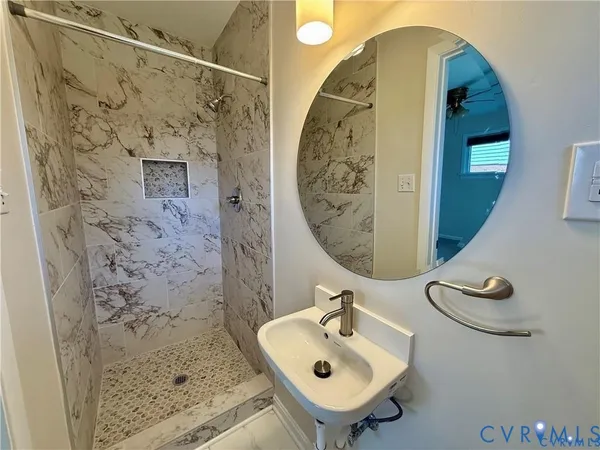 a bathroom with a sink and mirror