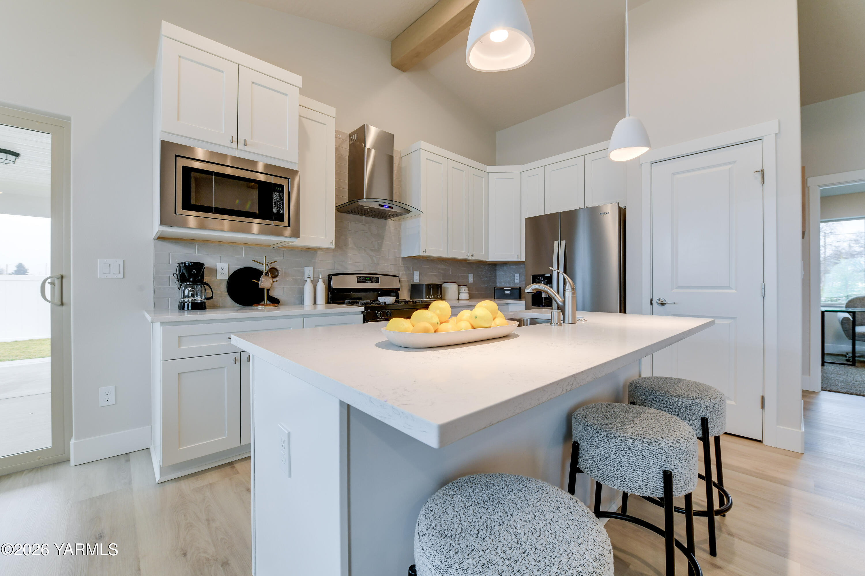 903 North Euclid Road, Unit PHASE 1 LOT 8) SPEC Grandview, WA 98930 - Photo 13 of 25 a kitchen with stainless steel appliances a stove a sink a microwave a refrigerator and cabinets
