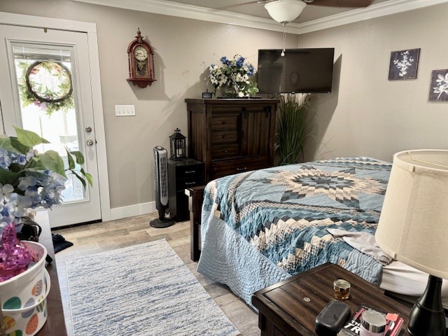 59 Private Road Dayton, TX 77535 - Photo 9 of 13 a bedroom with a bed and wooden floor