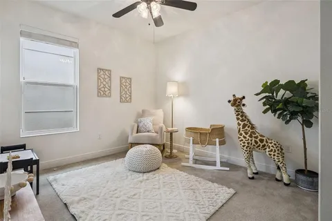 a view of a chairs and tables in the backyard