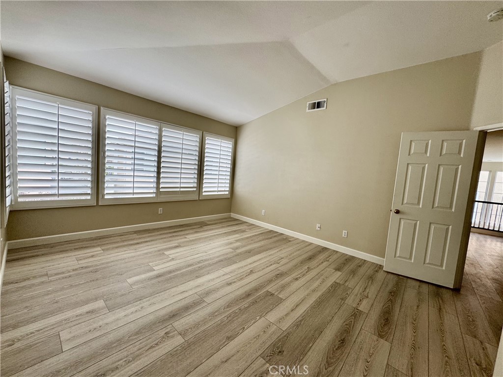 62 Northern Pine Loop Aliso Viejo, CA 92656 - Photo 14 of 27 a view of an empty room with wooden floor and a window