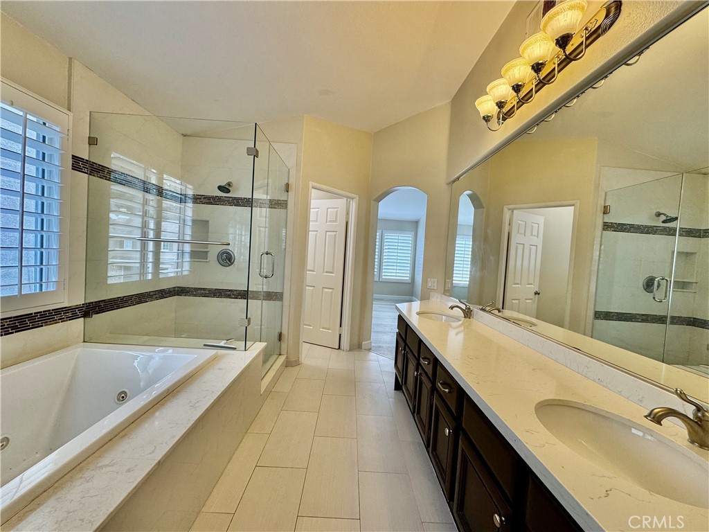 62 Northern Pine Loop Aliso Viejo, CA 92656 - Photo 15 of 27 a spacious bathroom with a tub sink shower and mirror