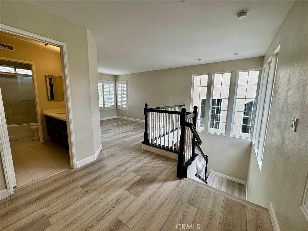 62 Northern Pine Loop Aliso Viejo, CA 92656 - Photo 17 of 27 a view of a room with wooden floor and windows