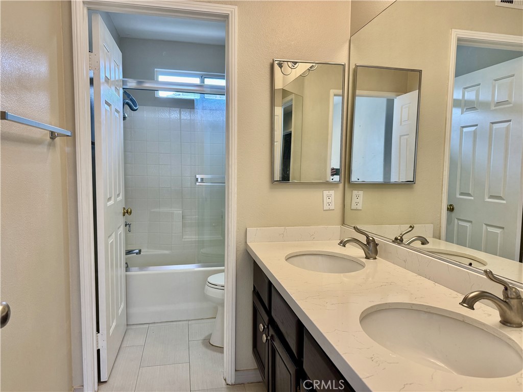 62 Northern Pine Loop Aliso Viejo, CA 92656 - Photo 20 of 27 a bathroom with a tub sink shower and mirror