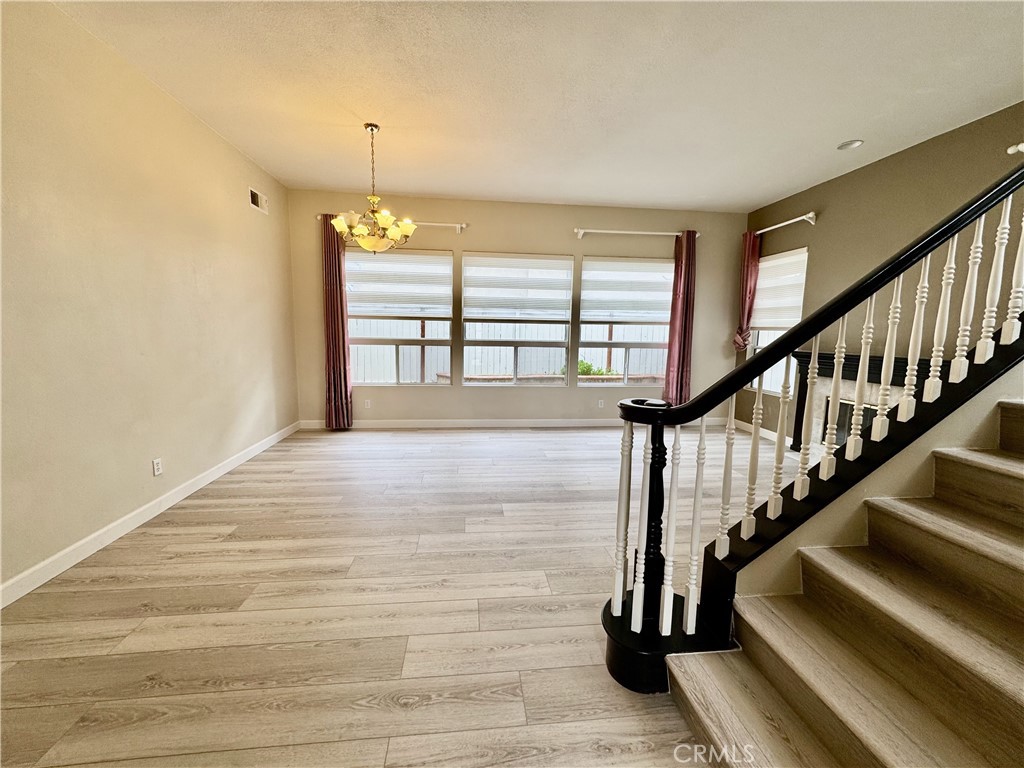 62 Northern Pine Loop Aliso Viejo, CA 92656 - Photo 2 of 27 a view of entryway and hall with wooden floor