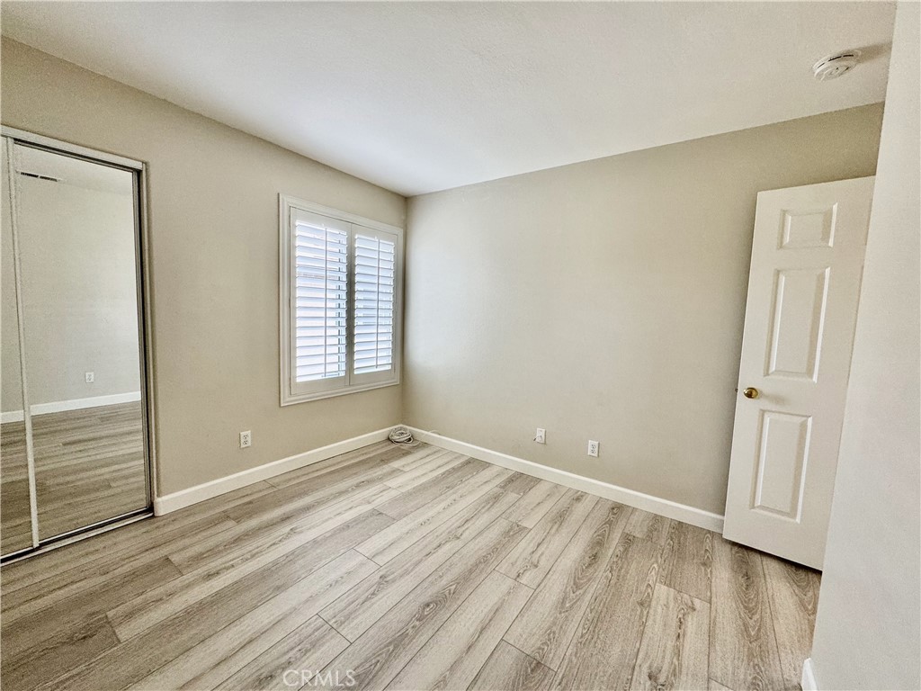 62 Northern Pine Loop Aliso Viejo, CA 92656 - Photo 24 of 27 a view of an empty room with wooden floor and a window