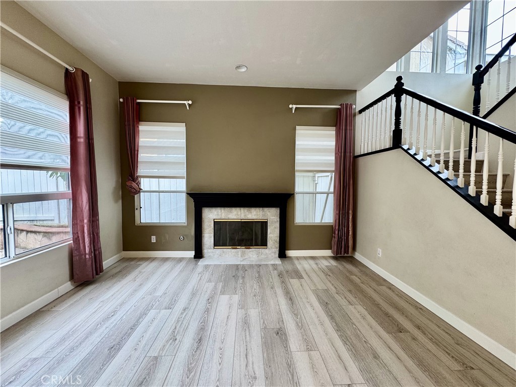 62 Northern Pine Loop Aliso Viejo, CA 92656 - Photo 3 of 27 a view of a livingroom with wooden floor and staircase