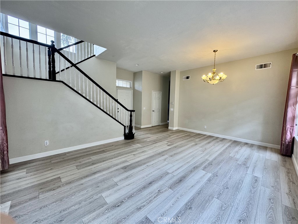 62 Northern Pine Loop Aliso Viejo, CA 92656 - Photo 4 of 27 a view of an empty room with wooden floor and stairs
