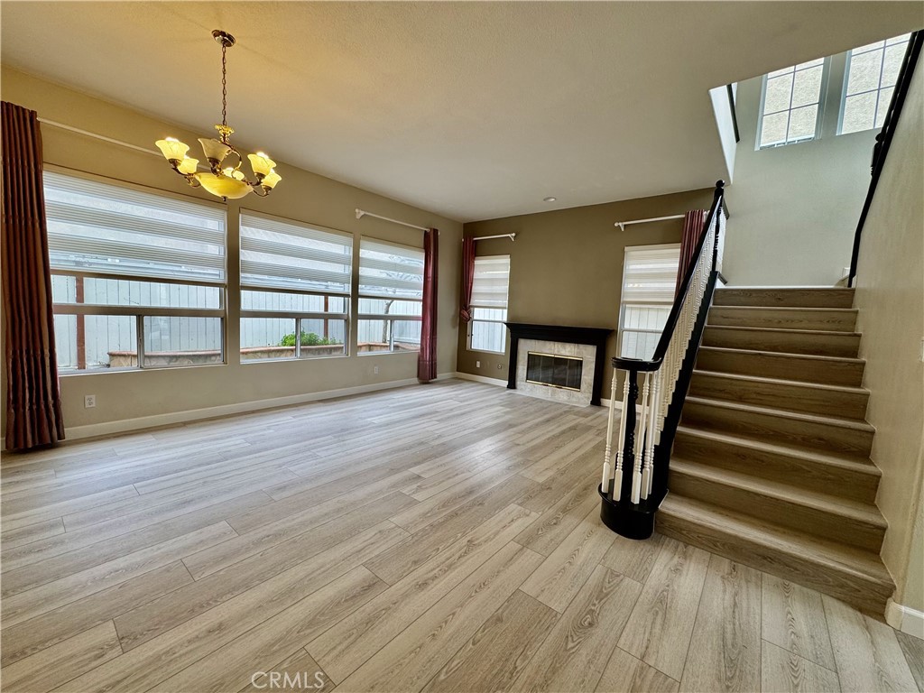 62 Northern Pine Loop Aliso Viejo, CA 92656 - Photo 5 of 27 a view of an empty room with wooden floor and a window