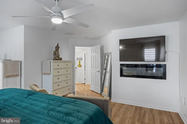 a bedroom with a bed and a television