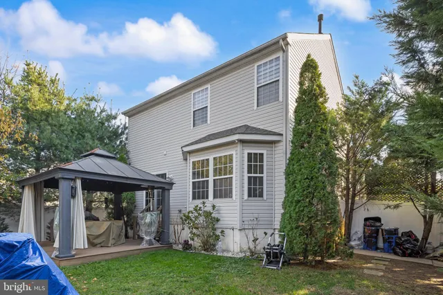 a front view of a house with a garden and porch