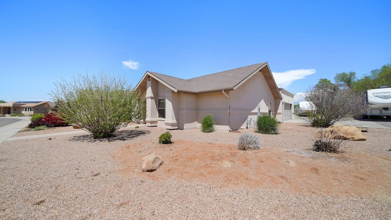 1296 Santa Fe Circle Fruita, CO 81521 - Photo 18 of 22 a view of a house with backyard and sitting area