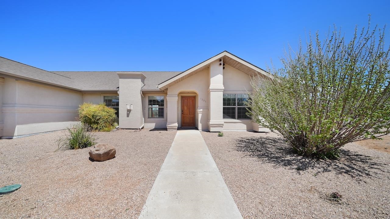 1296 Santa Fe Circle Fruita, CO 81521 - Photo 2 of 22 a view of a house with a yard