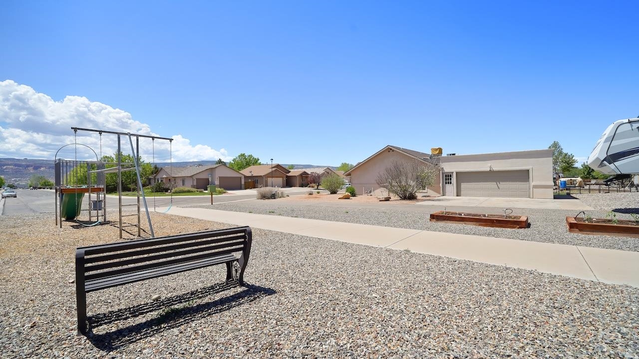1296 Santa Fe Circle Fruita, CO 81521 - Photo 22 of 22 a view of a patio with a bench