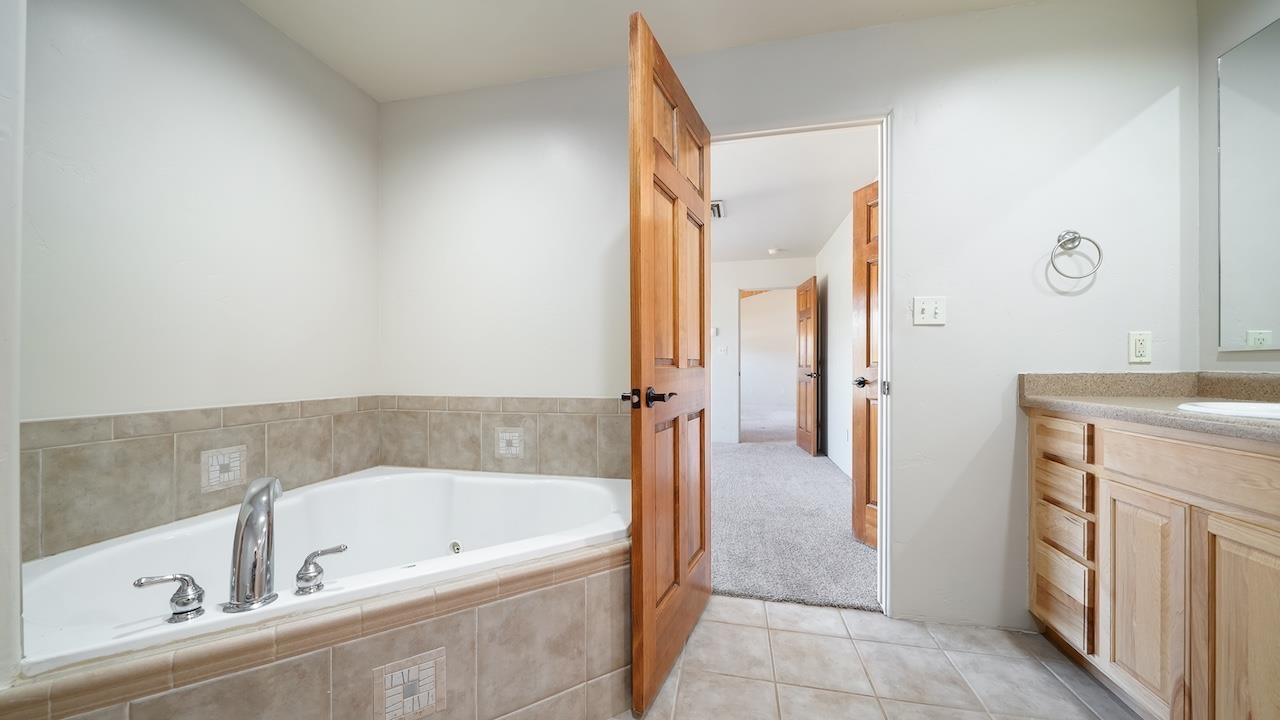 1296 Santa Fe Circle Fruita, CO 81521 - Photo 10 of 22 a bathroom with a bathtub and a sink