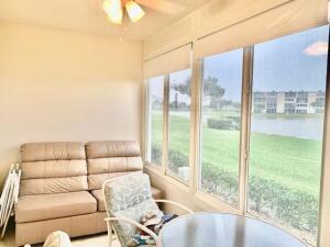 1050 Cornwall C Boca Raton, FL 33434 - Photo 13 of 27 Enclosed Patio w/Lake View