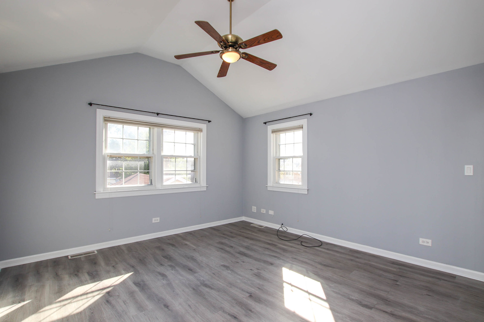 5815 North Canfield Avenue Chicago, IL 60631 - Photo 14 of 28 a view of an empty room with wooden floor and a window