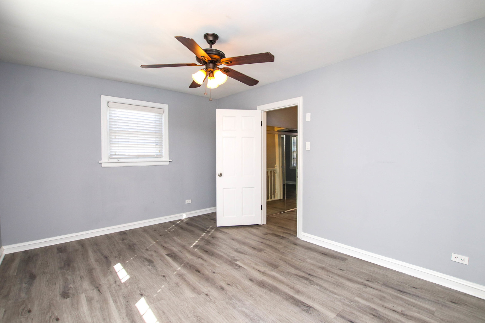 5815 North Canfield Avenue Chicago, IL 60631 - Photo 21 of 28 a view of a big room with wooden floor and windows in a room