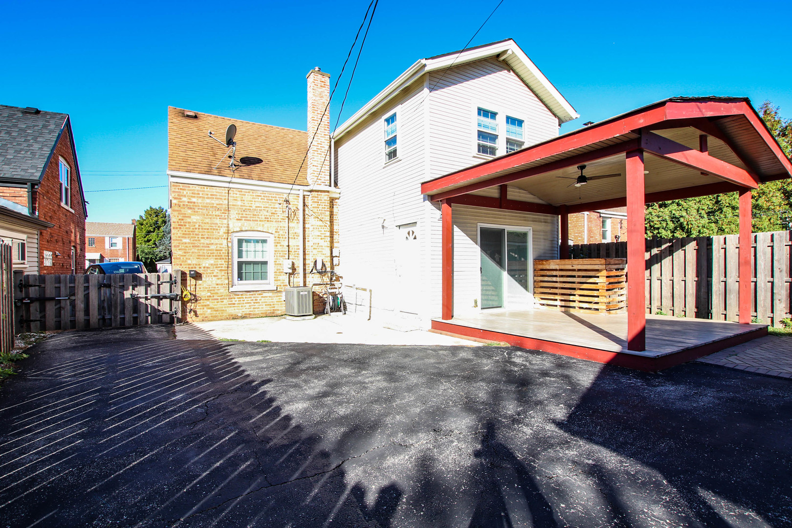 5815 North Canfield Avenue Chicago, IL 60631 - Photo 25 of 28 a backyard of a house with wooden floor and outdoor seating