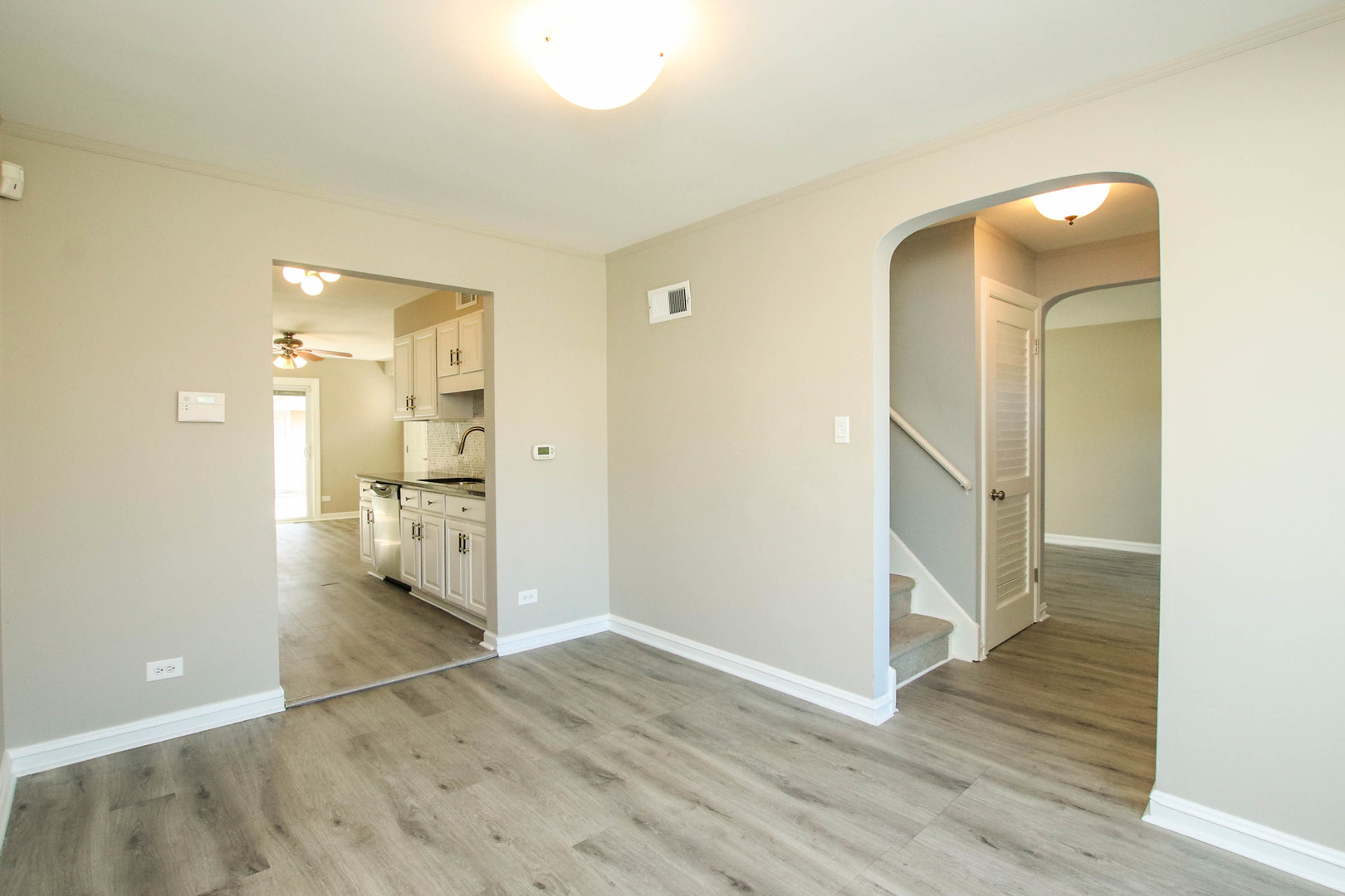 5815 North Canfield Avenue Chicago, IL 60631 - Photo 3 of 28 an empty room with wooden floor and bathroom