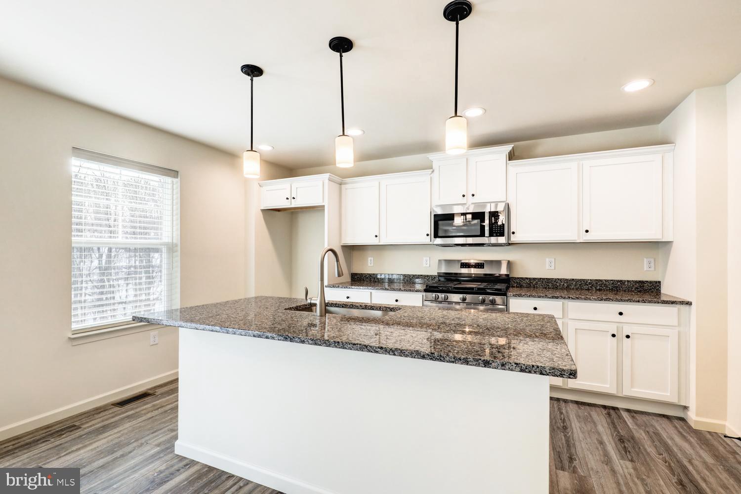 158 Leary Road Honey Brook, PA 19344 - Photo 17 of 41 Modern kitchen with sleek granite island.
