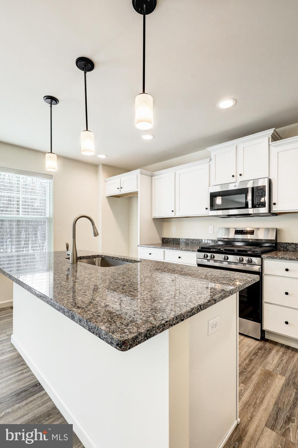 158 Leary Road Honey Brook, PA 19344 - Photo 2 of 41 Modern kitchen with sleek granite island.