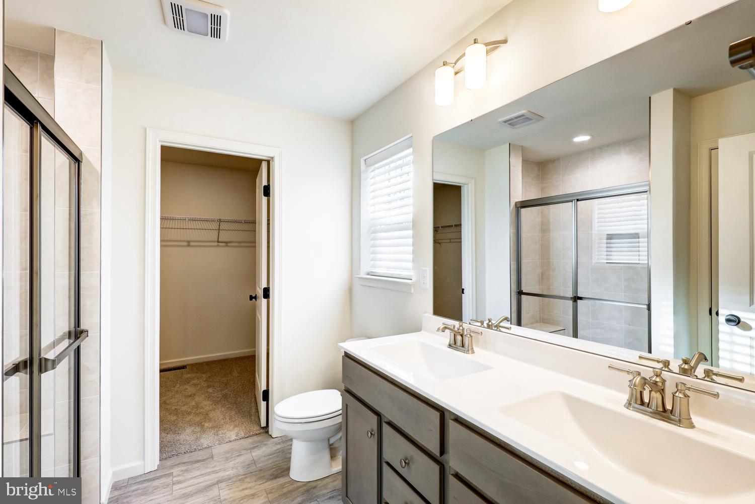 158 Leary Road Honey Brook, PA 19344 - Photo 28 of 41 Modern bathroom with dual sinks and light.