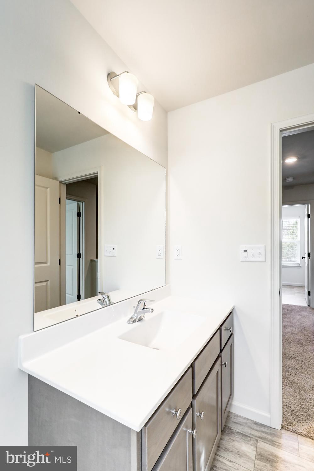 158 Leary Road Honey Brook, PA 19344 - Photo 34 of 41 Sleek modern bathroom with bright finishes.