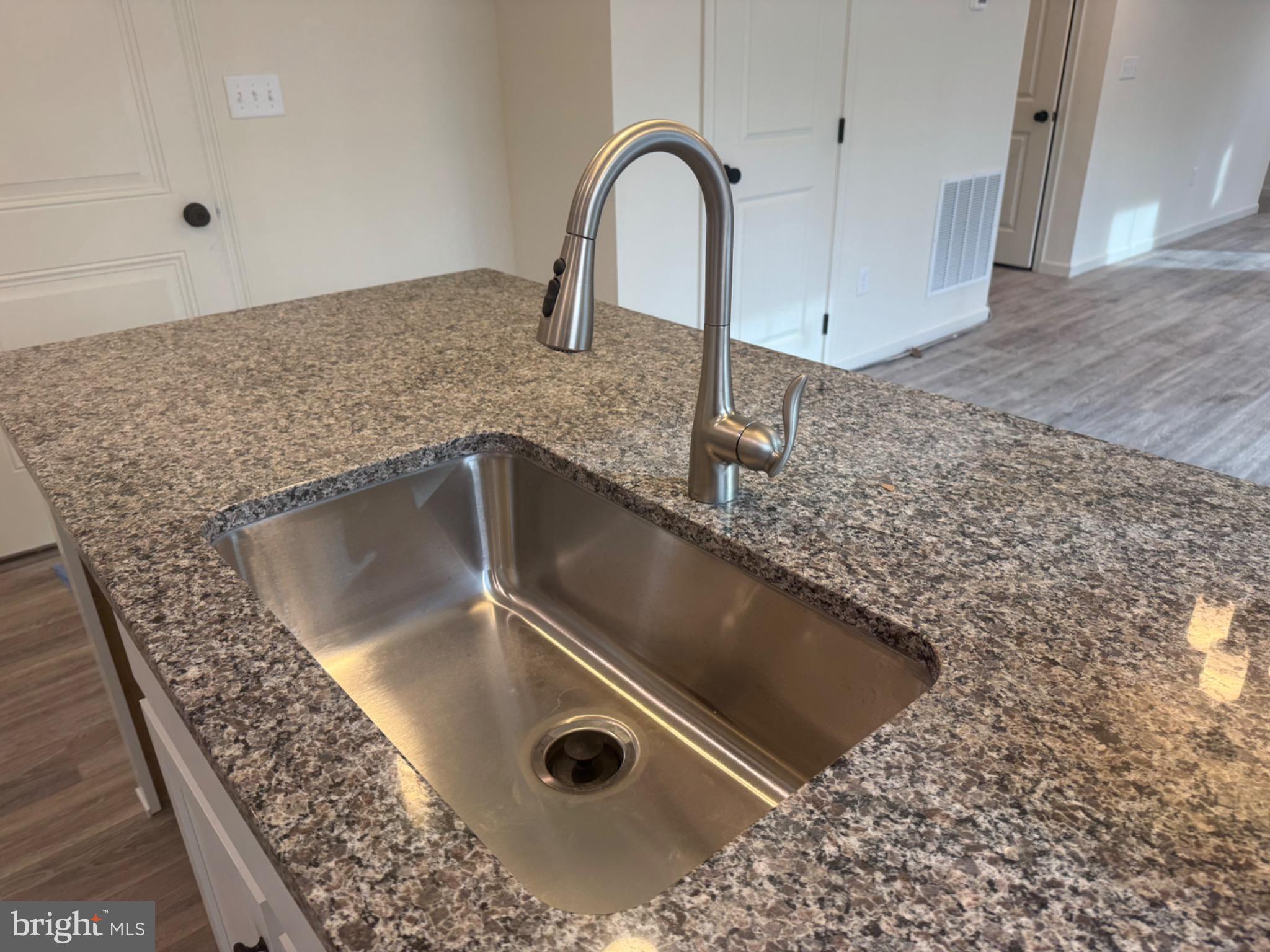 158 Leary Road Honey Brook, PA 19344 - Photo 4 of 21 Sleek granite countertop with modern faucet.