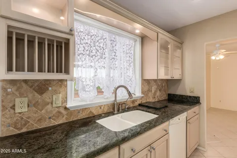 a kitchen with granite countertop a sink and a granite counter tops
