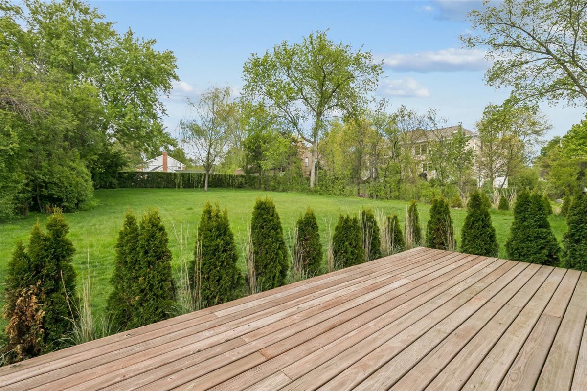 250 Wilshire Road Lake Forest, IL 60045 - Photo 23 of 28 a view of a backyard with wooden floor and a lake view