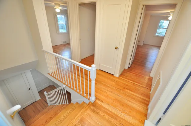 a bathroom with a sink a toilet and a window