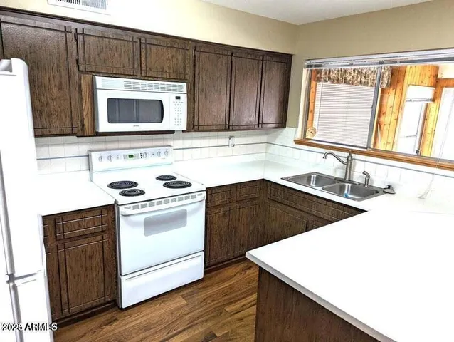 a kitchen with a stove and a microwave