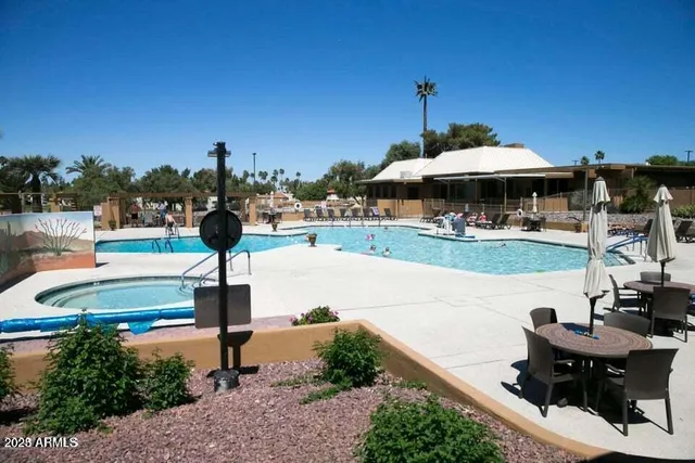 a view of a swimming pool with a patio