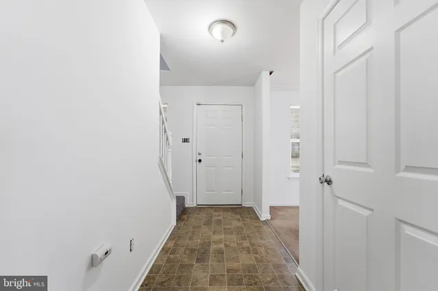a view of a bathroom from a hallway