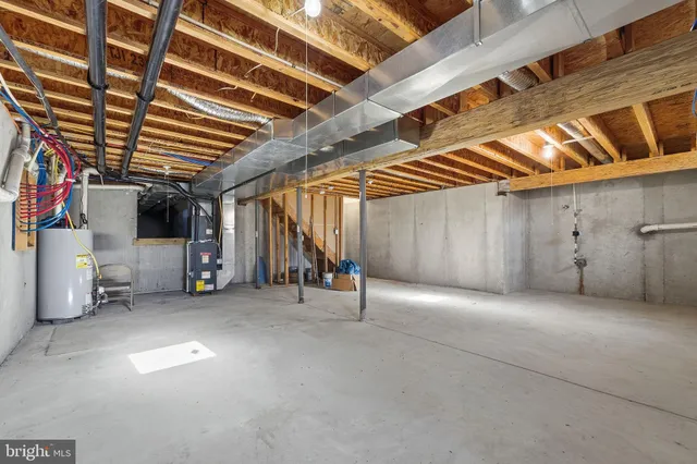 a view of empty room with wooden ceiling